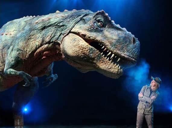 Michaela Strachan and the mighty T-Rex, one of the stars of Walking With Dinosaurs - The Arena Spectacular.