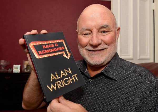 Alan Wright with his book Rags and Reminders. Picture by FRANK REID
