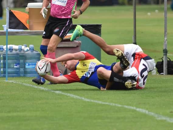 Peter Howe scores Hartlepool's first try of the tournament in the opening game against Lao Nagas. Picture by PAUL LINCOLN