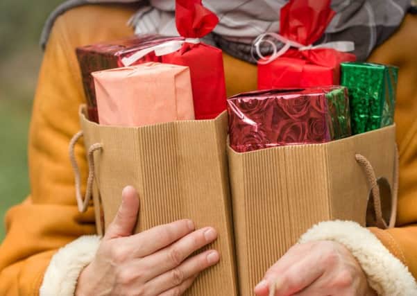 A Generic Photo of person carrying lots of Christmas shopping. See PA Feature WELLBEING Christmas Workouts. Picture credit should read: PA Photo/thinkstockphotos. WARNING: This picture must only be used to accompany PA Feature WELLBEING Christmas Workouts.