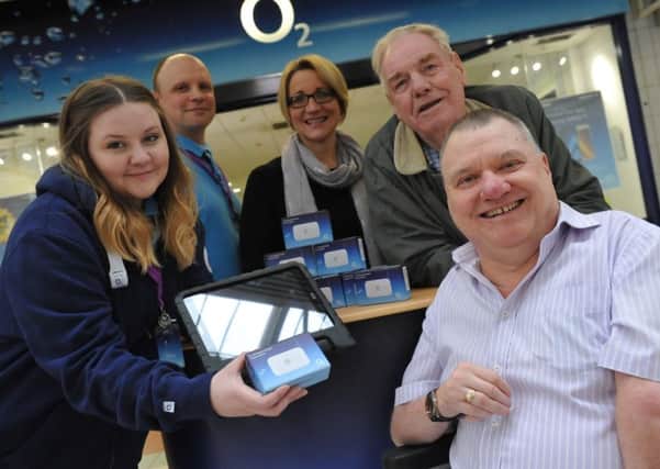 O2's Amy Tucker hands over the WiFi hotspots to Michael Slimings, with Ben Jones, Jeanette Willis and Robbie Bousfield.