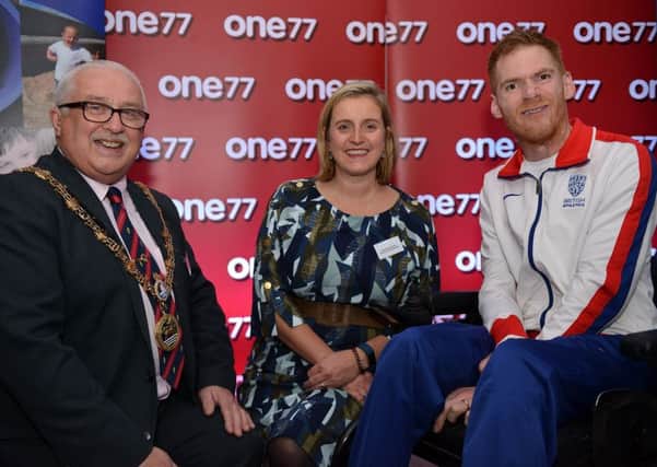 Mayor of Hartlepool Councillor Paul Beck and chair of trustees Pamela Hargreaves welcome triple Paralympic medalist Stephen Miller MBE to Families First North East at Cafe 177. Picture by FRANK REID
