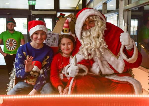Santa with PJ Foster (10) and Lacey Foster (6)