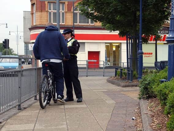 A PCSO talks to a cyclist at the junction of Victoria Road and Stockton Street, Hartlepool, in 2015.