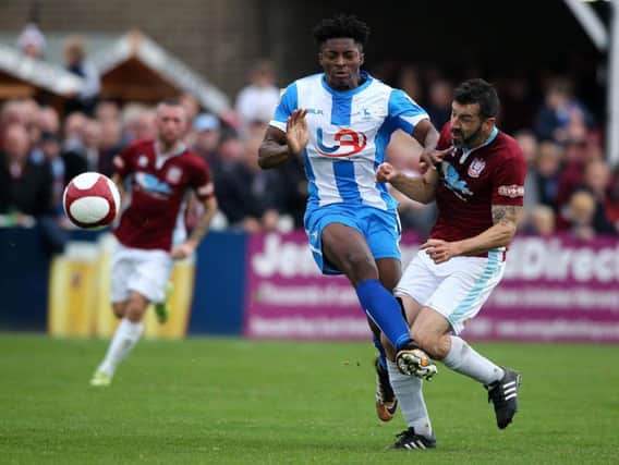 Goal hero Devante Rodney collides with Julio Arca in Pools's FA Cup win at South Shields. Picture by TOM BANKS