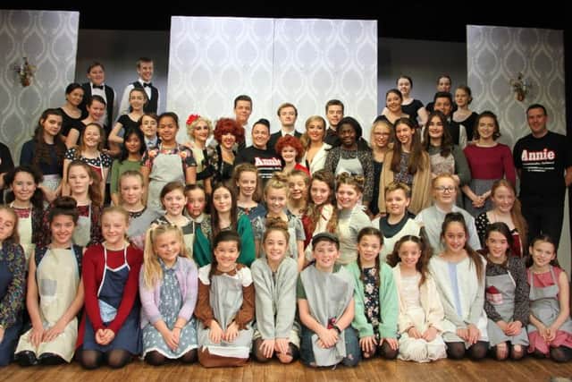 The full cast of Annie  made up of English Martyrs School and Sixth Form College students.