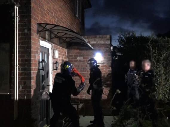 Police pictured during one of the raids. Photo by Durham Constabulary.