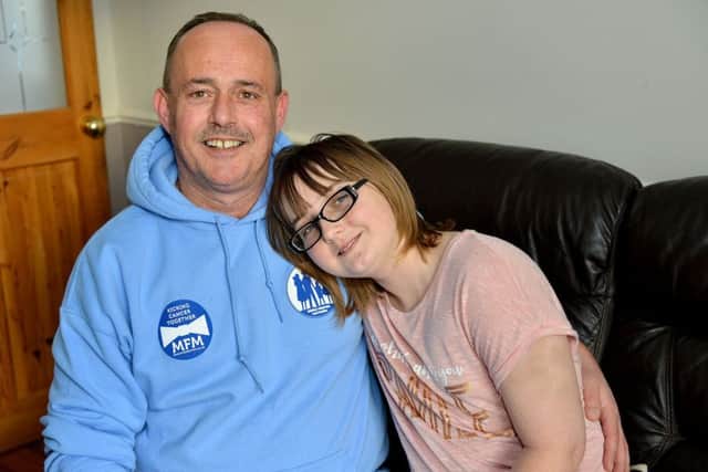 Elly Mae Waugh (12) with her dad Dean (48). Picture by FRANK REID