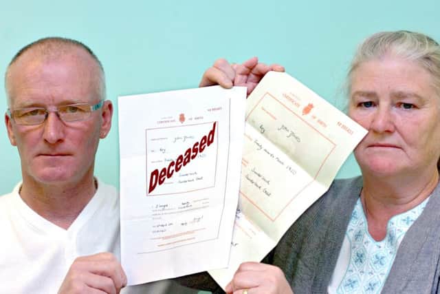 Alf Jones and Freda Woods with copies of their late brother John Jones' birth certificate and a suggestion as to what it should look like if records were changed to show that someone had died.