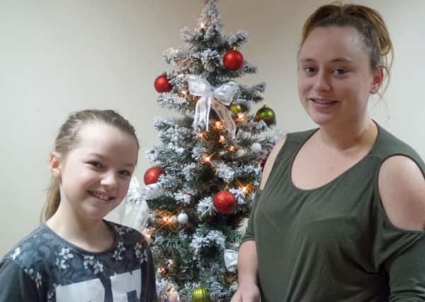 Helpers at Wharton Trust Tammy Weldrake and Lillie Rose Mann wholl be serving festive treats at the drop in event on December 12th