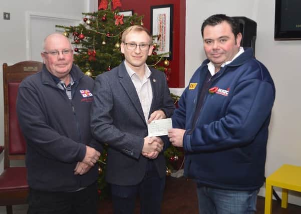 Hartlepool Round Table chairman Dominic Wheatley, centre,  presents a cheque to Mike Craddy, left, and Robbie Maiden of  Hartlepool RNLI.