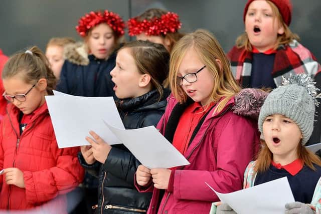 Rift House Primary School pupils singing carols in Middleton Grange Shopping Centre.