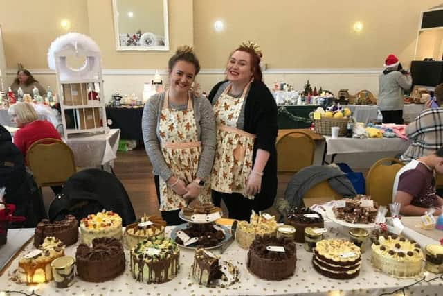 All smiles on the cake stall.