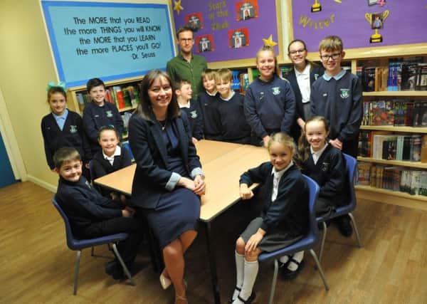 Greatham Primary School headteacher Nicola Dunn and deputy headteacher Michael Piper with pupils celebrating the school's League Table result.