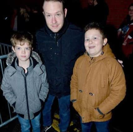 From left: Harry, John and Thomas Dunn in the queue for the screening of Dr Who at Hartlepool.