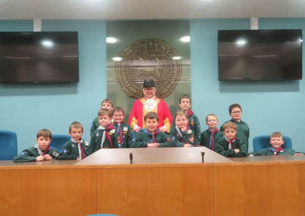 Mayor of Hartlepool Councillor Paul Beck with children from the 18th St Paul's cubs in the council chamber