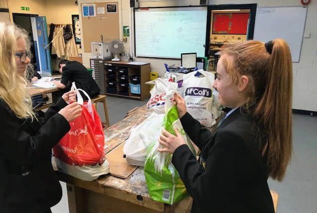 High Tunstall College of Science pupils bag up items for those in need at Christmas.
