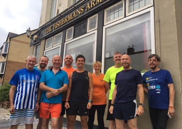 Phil Holbrook (far left) with supporters on a previous memorial run for late wife Sally