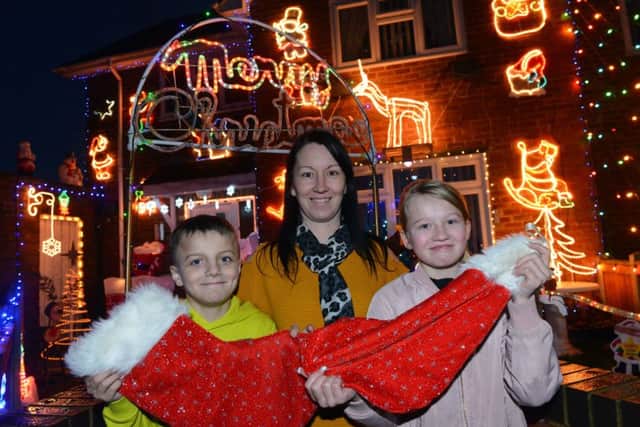 Hartlepool Stop, Look and Glisten Christmas house light decoration winners on Motherwell Road,
Michelle Simpson with children Shay Hogg, 11 and Macie-Jai Simpson, 11.