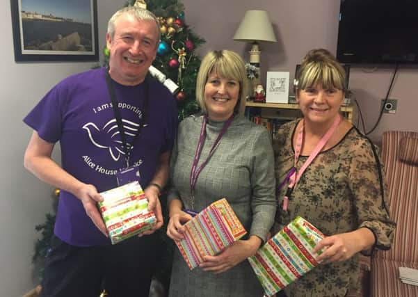 Hospice staff pictured with the gifts - left to right, Michael Allen, Jan Dunn, and Paula McIver.