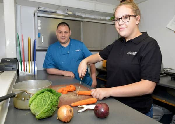 Chef Ashley Carr in the kitchen at Cafe One77 York Road with trainee Holly Thompson.
