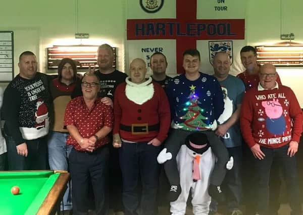 The South Durham Steelworks Social Club snooker players in their festive jumpers and outfits.