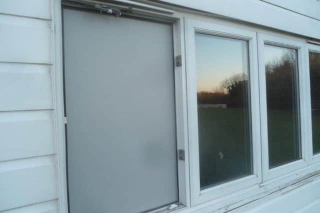 The boarded up window where thieves broke in to Wolviston Football Club