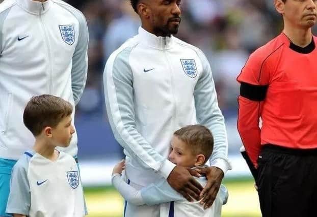 A tender moment between Jermain Defoe and Bradley Lowery during the England match at Wembley Stadium.