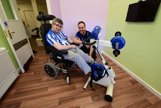 Sports Therapist Kevin Spanton helping Richard Watts, one of the residents at the Yohden Care Complex, Heselden Road. Blackhall to keep fit in their new gym.