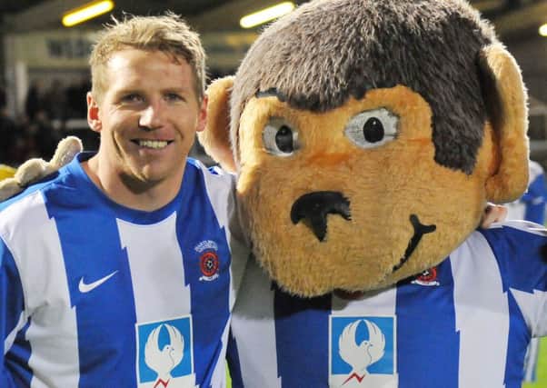 Ritchie Humphreys celebrates his 500th Pools appearance with H'Angus.