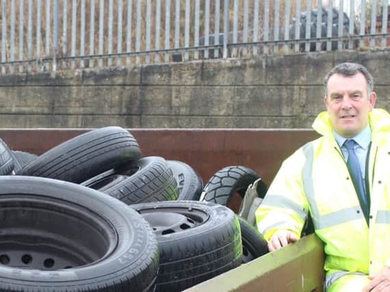 Hartlepool Borough Council's team leader for operations and grounds maintenance Garry Jones with some of the dumped tyres.