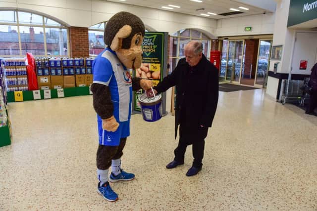 Hartlepool United mascot H'Angus collecting from shoppers at Morrisons, Hartlepool.