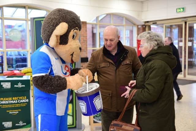 Hartlepool United mascot H'Angus collecting from shoppers at Morrisons, Hartlepool,, raising funds to hrelp save the club.