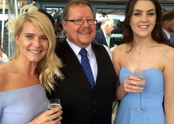 Dean Moore with his daughter Claire (left) and step daughter Eleanor.