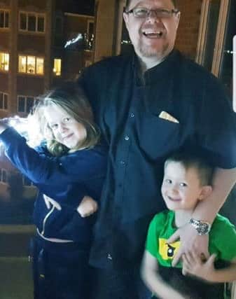 This was the last photograph of Dean, taken with his grandchildren Lily and Max Moore.