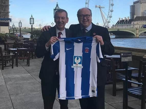 MPs Mike Hill and Grahame Morris, who backed the Early Day Motion, with a Hartlepool United shirt.