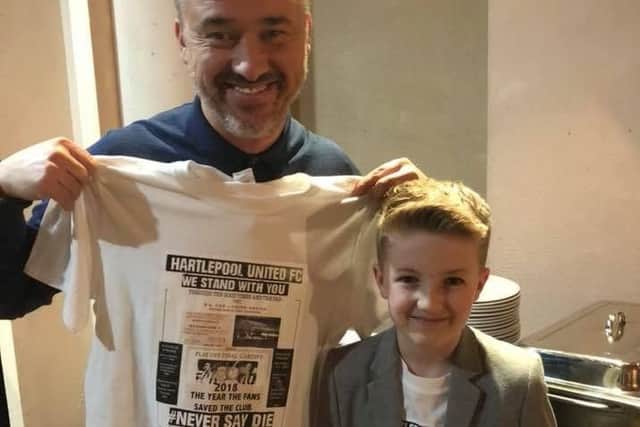 Stephen Hendry poses with the Hartlepool United We Stand With You T-shirt.