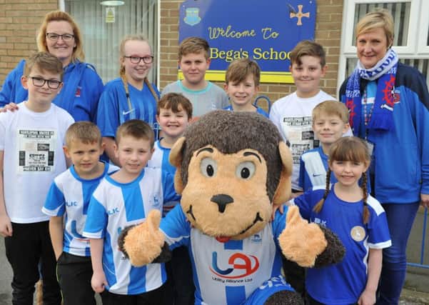 St Bega's RC Primary School pupils join H'Angus to show their support to Hartlepool United.