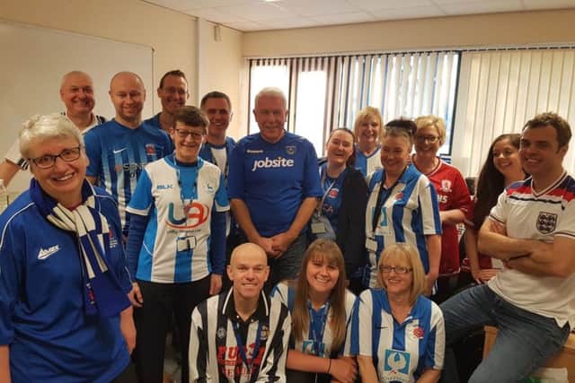 Hartlepool Borough Council staff in their football shirts, including (far left in dark blue shirt with scarf) the councils chief executive Gill Alexander and (next to her, with glasses and in shirt with blue and red logo) Jayne Gardner.