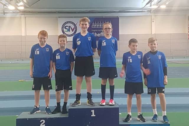 Dyke House Sports and Technology College youngsters try out the medal podium.