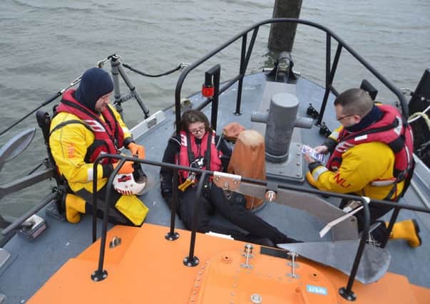 Hartlepool RNLI volunteers pictured on the all weather lifeboat and in the water during the training exercise. Picture: RNLI/Tom Collins.