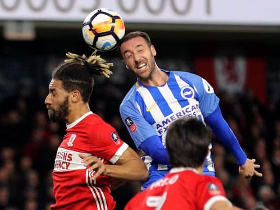 Brighton & Hove Albion's Glenn Murray (right) and Middlesbrough's Ryan Shotton battle for the ball in the air during the Emirates FA Cup fourth round match. PA Photo.