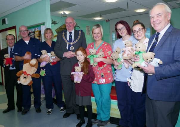 Freemasons of Durham hand out TLC bears at North Tees and Hartlepool NHS Foundation Trust's A&E department.
