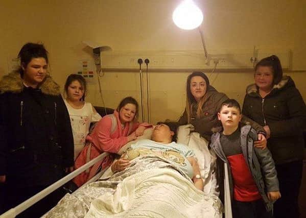 Shelley Ellis surrounded by her family in hospital shortly before her death at just 39. This picture was released with the consent of her family.