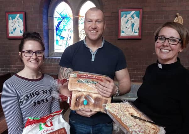 Charlotte Randall-Pape, Mark Shrubb and Rev Gemma Sampson with some of the items donated to The Family Kitchen's first gathering.