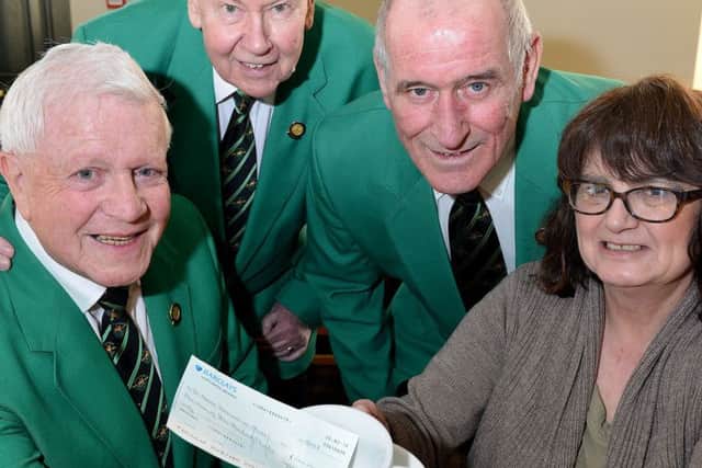 Hartlepool Male Voice Choir members (left to right) John Rutherford, Duncan Graham and Mick Waller present Janice Forbes from Alice Hospice with a cheque for Â£500. Picture by FRANK REID