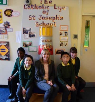 Headteacher Rachel Williams with some of her pupils.