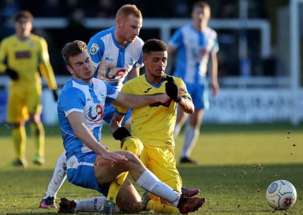 Rhys Oates makes a tackle for Pools on Saturday.