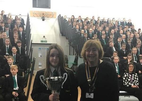 Macey Boylan of Manor Academy is handed the Ian Cameron Cup by Rotary Club president Dr Lynne Humphries.