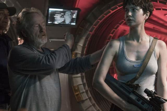 Sir Ridley Scott gives some advice to Katherine Waterston during filming of Alien Covenant. Pic: PA.